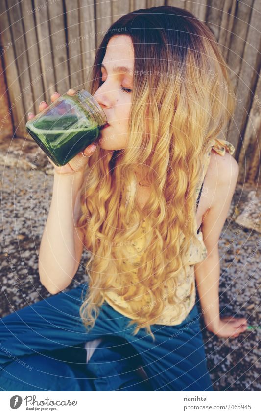 Young woman drinking a green smoothie Vegetable Nutrition Organic produce Vegetarian diet Beverage Drinking Juice Milkshake Detox Lifestyle Style Beautiful