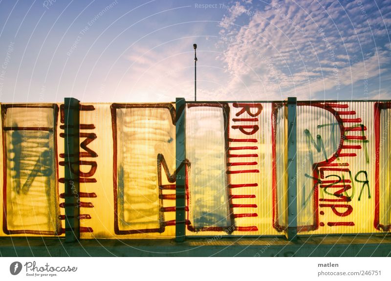 slide Deserted Wall (barrier) Wall (building) Highway Sign Characters Graffiti Blue Yellow Clouds Sky Vista Screening Colour photo Multicoloured Exterior shot