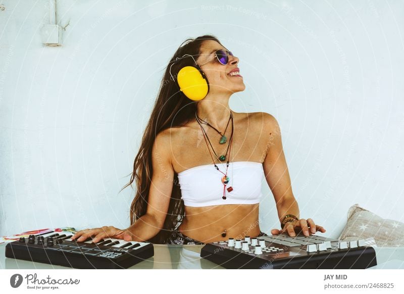 woman sitting with mixing table, producing music Lifestyle Joy Summer Table Music Disc jockey PDA Keyboard Technology Woman Adults Body 1 Human being Artist