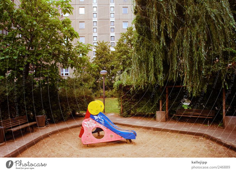 playground Leisure and hobbies Playing Tree Whimsical Playground Slide Sandpit High-rise Berlin Town Park Bench Colour photo Exterior shot Deserted Light Shadow