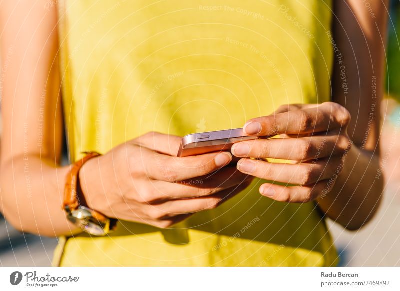 Young Woman Checking Her Mobile Phone Telephone Hand PDA Hold Solar cell Close-up using Internet Smart Technology Communication Social Human being Lifestyle