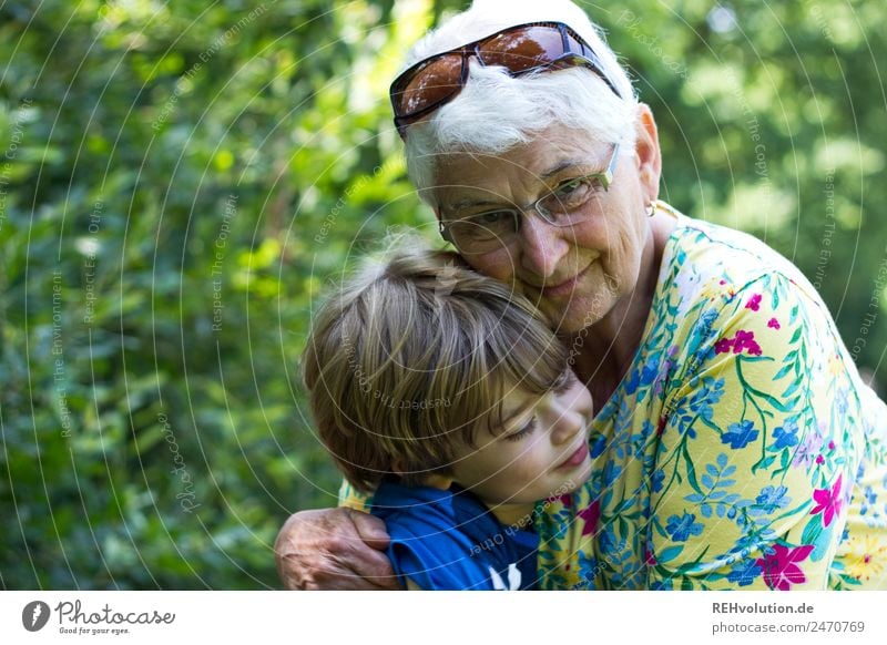Grandma cuddles up with her grandson grandma Child Grandmother Senior citizen Family & Relations Female senior Sunglasses Happy Together naturally Trust Safety