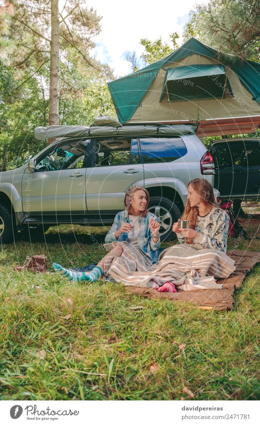 Women sitting under blanket with 4x4 on background Coffee Lifestyle Joy Happy Relaxation Leisure and hobbies Vacation & Travel Trip Adventure Camping Summer