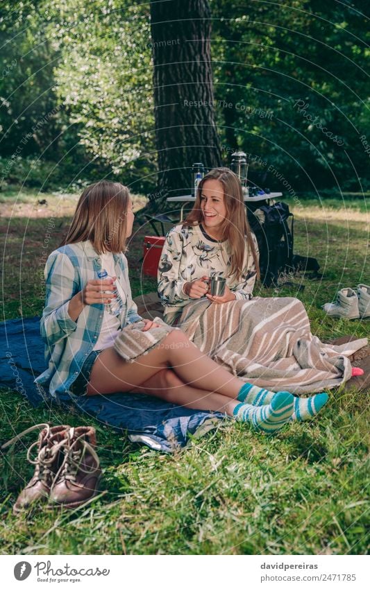 Women friends laughing sitting in the campsite Coffee Lifestyle Joy Happy Relaxation Leisure and hobbies Vacation & Travel Trip Adventure Camping Summer