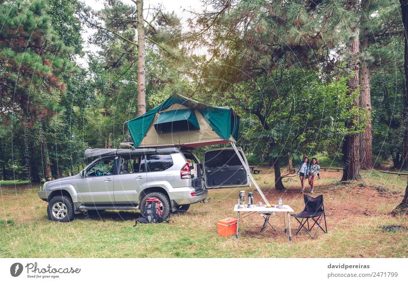 Camping table and off road vehicle in campsite Lifestyle Joy Happy Relaxation Leisure and hobbies Vacation & Travel Tourism Trip Adventure Summer Mountain