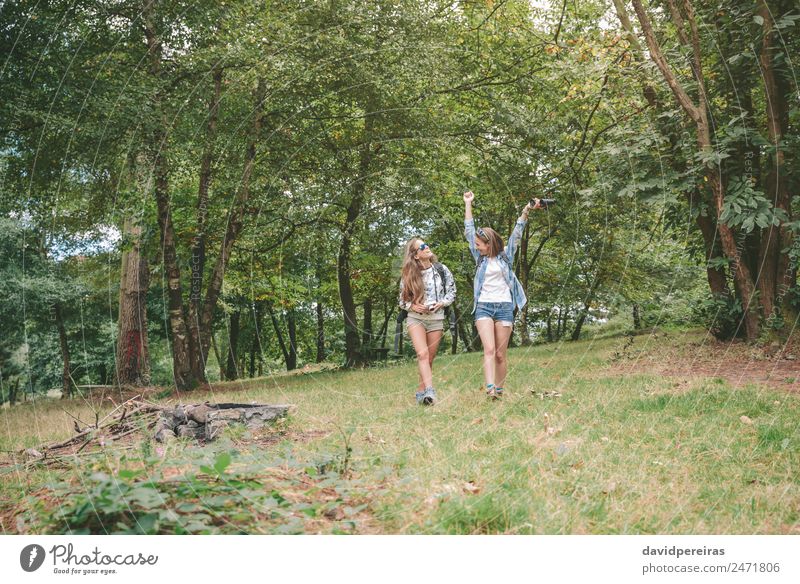 Happy woman hiker hiking couple in nature trek on hike trail on summer  travel vacations. Healthy lifestyle young Asian girl smiling enjoying walk  with man. Stock Photo