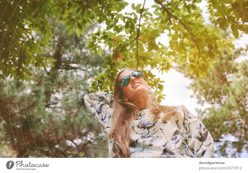 Woman with sunglasses touching over nature background Lifestyle Joy Happy Relaxation Leisure and hobbies Freedom Summer Mountain Human being Adults Bottom