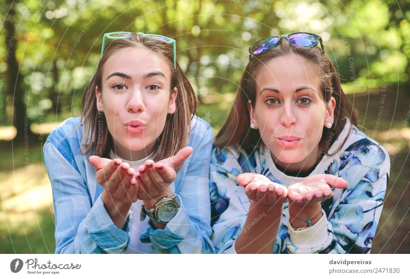 Two women friends blowing kiss to camera Lifestyle Joy Happy Beautiful Leisure and hobbies Vacation & Travel Trip Camping Summer Mountain Hiking Human being