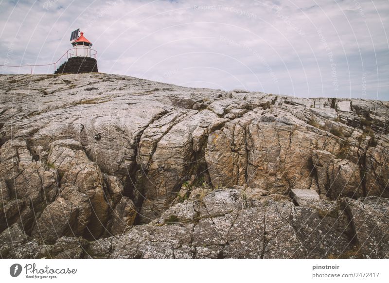 Lighthouse on round in Norway Island Landscape Sky Clouds Summer Coast Fjord Fishing village Building Navigation Ferry Watercraft Stone Maritime Europe
