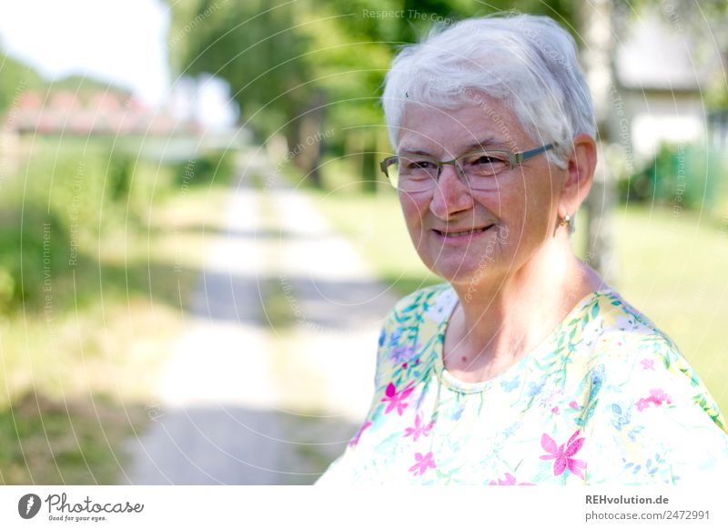 Senior smiles Senior citizen Female senior Woman 60 years and older portrait Old Grandmother Nature Eyeglasses Gray-haired White-haired Authentic naturally