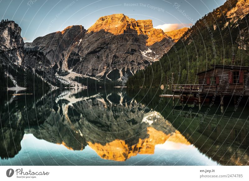 The Braies Wildsee with reflection of the mountains, the boathouse with alpenglow Vacation & Travel Tourism Trip Summer Summer vacation Mountain Nature