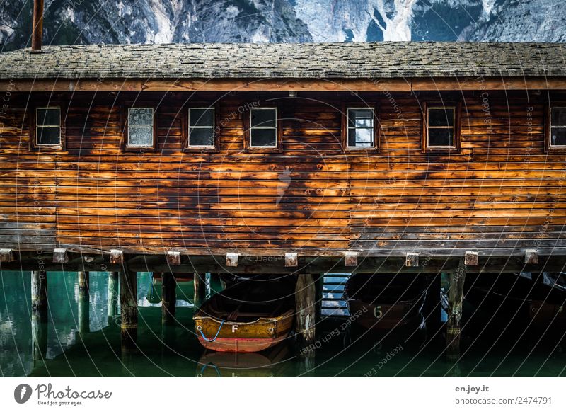 stilted Leisure and hobbies Vacation & Travel Trip Mountain Alps Lake Pragser Wildsee Lake Hut Boathouse Facade Window Rowboat Wood Adventure Relaxation