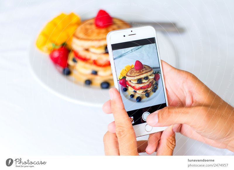 Closeup of hands taking a picture of breakfast with a smartphone Dessert Breakfast Lunch Plate Table Telephone Cellphone Camera Technology Man Adults Hand