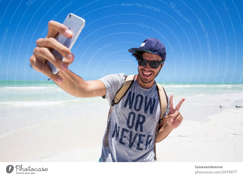 Millenial traveler taking a selfie Lifestyle Joy Vacation & Travel Summer Beach Human being Man Adults Sunglasses Hat Smiling Exotic Happy Funny Modern