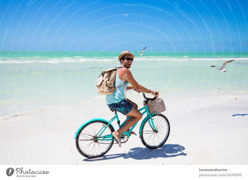 Man riding a bike on the sea shore Lifestyle Joy Relaxation Vacation & Travel Freedom Summer Sun Beach Ocean Sports Cycling Human being Homosexual Adults 1