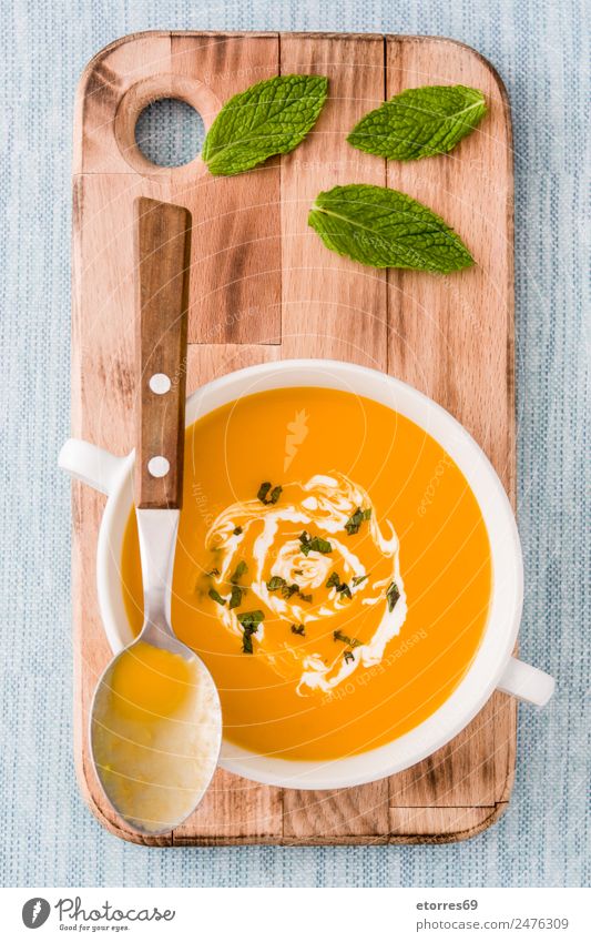 Pumpkin soup in white bowl Food Vegetable Soup Stew Herbs and spices Nutrition Organic produce Vegetarian diet Diet Beverage Hot drink Bowl Spoon Natural Blue