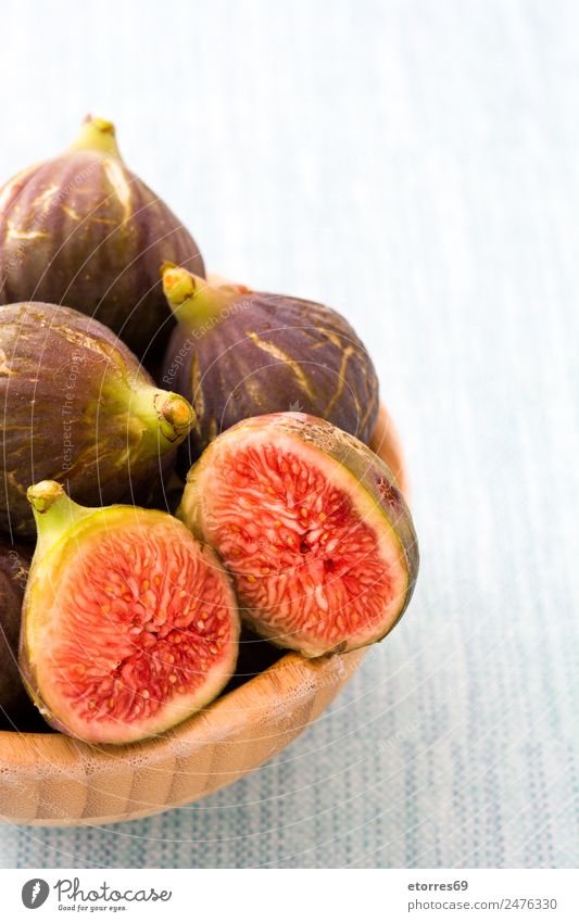 Fresh figs in bowl on blue background Food Fruit Nutrition Breakfast Organic produce Vegetarian diet Diet Natural Blue Red Fig Food photograph Candy Healthy Raw