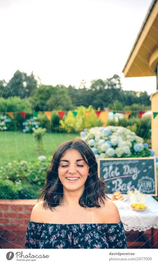 Young woman with closed eyes laughing over nature background Lunch Lemonade Lifestyle Joy Happy Leisure and hobbies Summer Garden Table Blackboard Human being
