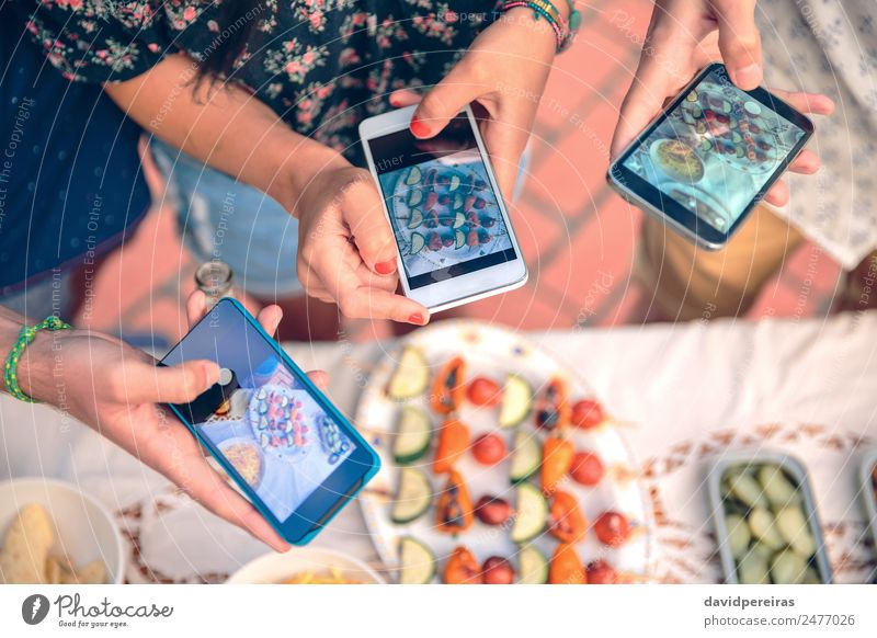 Young hands taking photos with smartphones to vegetable skewers Vegetable Lunch Plate Lifestyle Joy Happy Summer Table Telephone PDA Technology Woman Adults Man