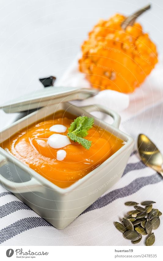 Cream of pumpkin in bowl. Food Vegetable Soup Stew Lunch Dinner Vegetarian diet Diet Plate Bowl Spoon Healthy Healthy Eating Autumn Hot Delicious Sour Yellow