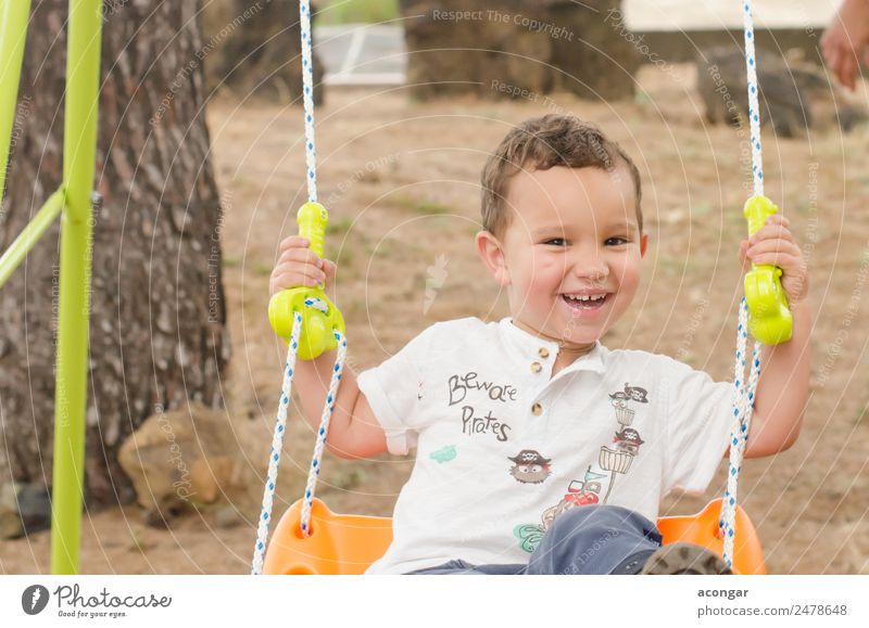 Little boy of 2 years, very smiling, sitting on a swing. Lifestyle Happy Summer Human being Masculine Child Boy (child) Infancy Face 1 1 - 3 years Toddler