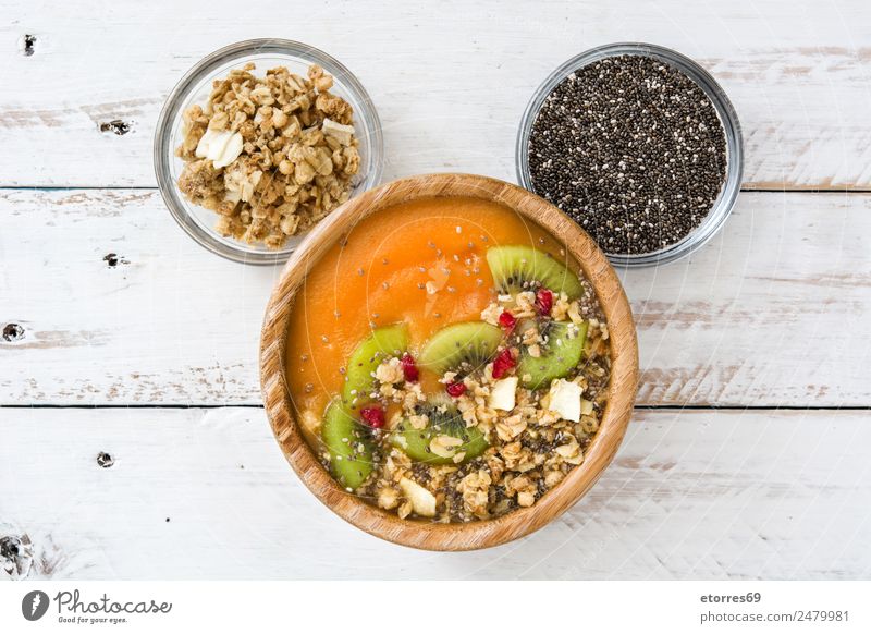 Smoothie with fruit,cereals and chia on white wooden table Food Yoghurt Fruit Orange Nutrition Eating Breakfast Organic produce Vegetarian diet Diet Juice Milk