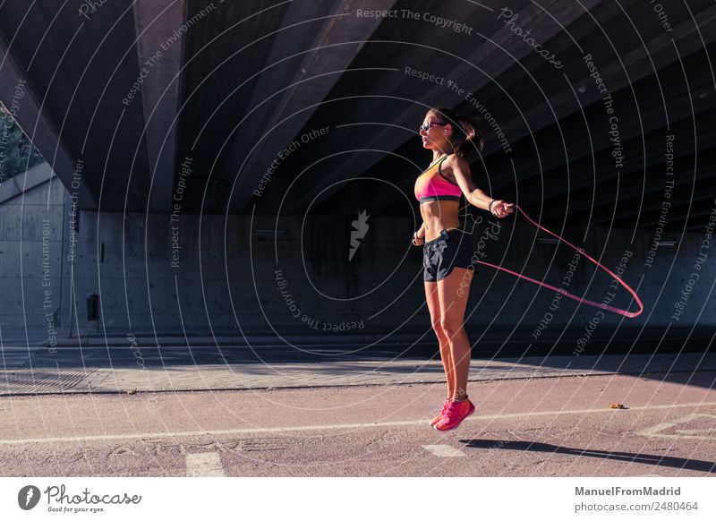 Athletic Woman Jumping With Skipping Rope A Royalty Free Stock Photo From Photocase