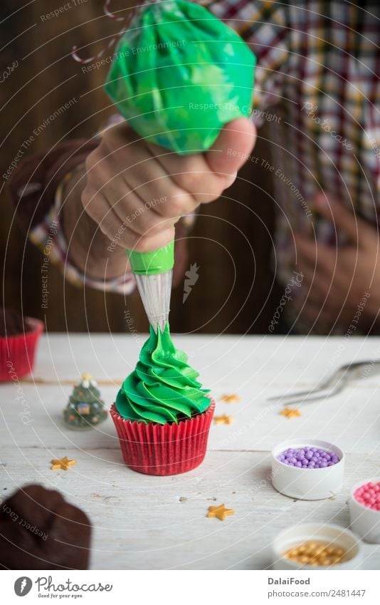 Making cupcake for christmas time Dessert Winter Decoration Feasts & Celebrations Christmas & Advent Tree Wood Delicious New Green Red White background Baking