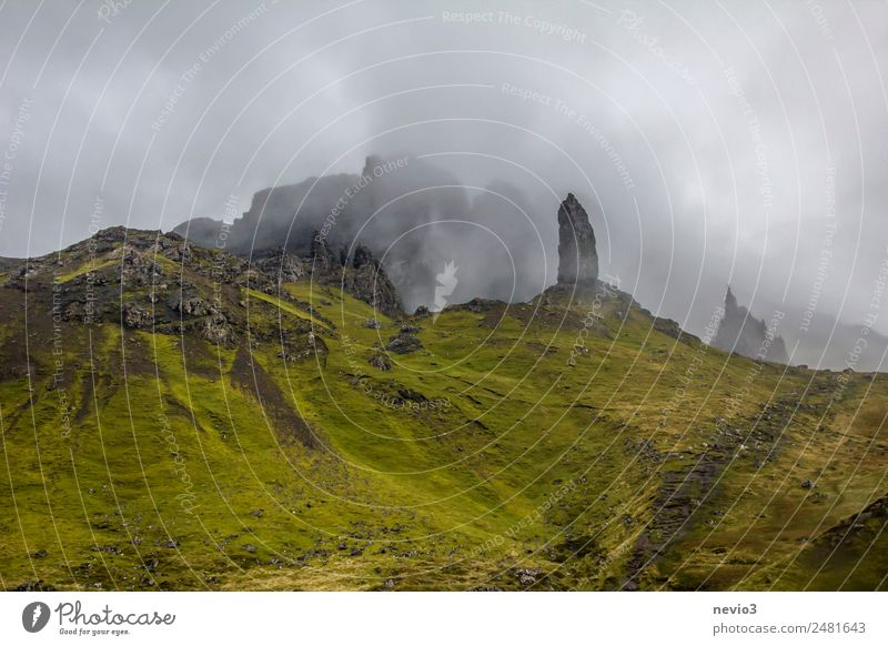 Old Man of Storr on the Isle of Skye in Scotland Landscape Clouds Summer Autumn Bad weather Fog Grass Green Travel photography Island Mountain Mountaineering