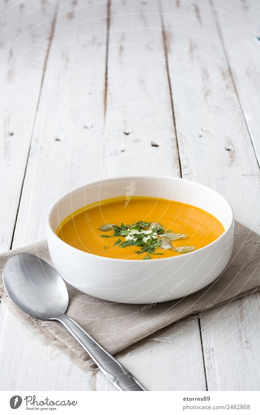 Pumpkin soup in white bowl on white wooden table Food Healthy Eating Food photograph Dish Vegetable Soup Stew Nutrition Organic produce Vegetarian diet