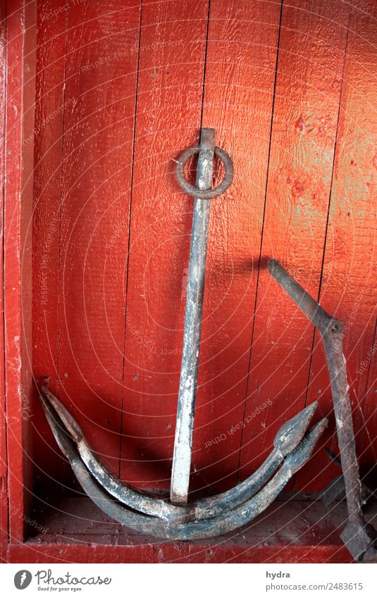Old anchor Stockanke in front of red wooden wall in boat shed Anchor Decoration Fishing village hut Harbour Wall (barrier) Wall (building) Navigation Metal Red