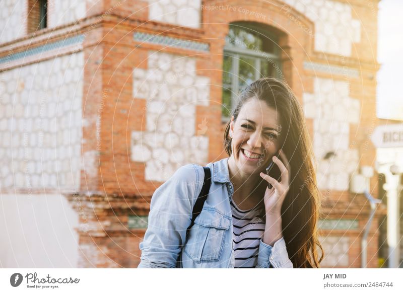 beautiful woman talking on the phone while laughing. Lifestyle Style Joy Happy Beautiful To talk PDA Technology Feminine Young woman Youth (Young adults) Woman