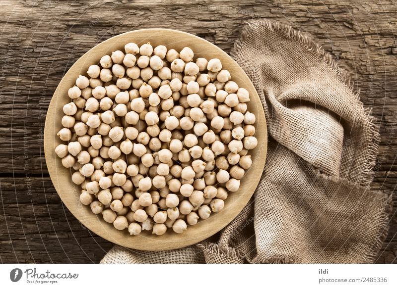 Raw Chickpeas Vegetable Nutrition Healthy Natural food garbanzo Beans Gram Peas legume Pulse dry Dried dehydrated cooking Protein cicer arietinum wooden plate