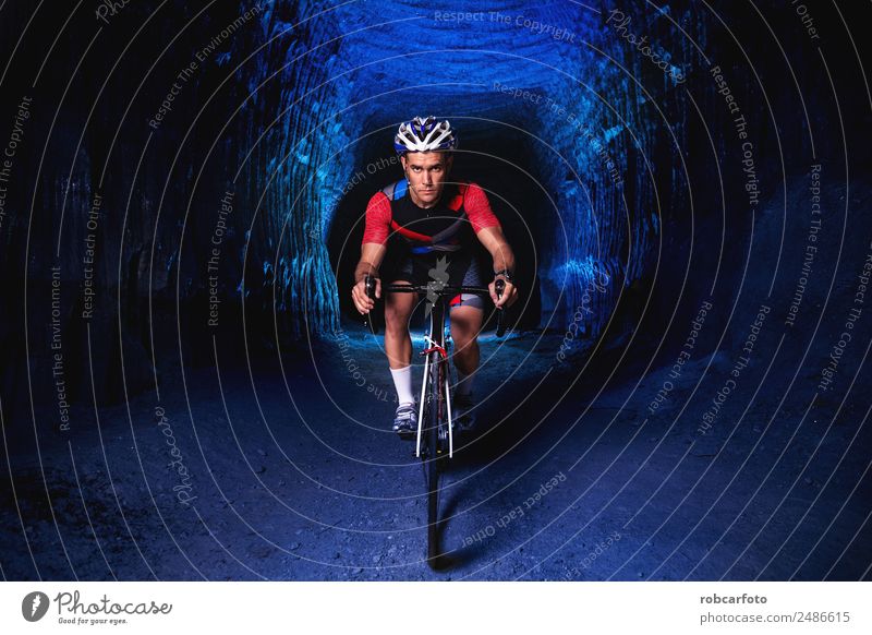 Man on bicycle preparing for triathlon race Far-off places Summer Sports Cycling Human being Adults Street Movement Fitness Speed Green White Competition