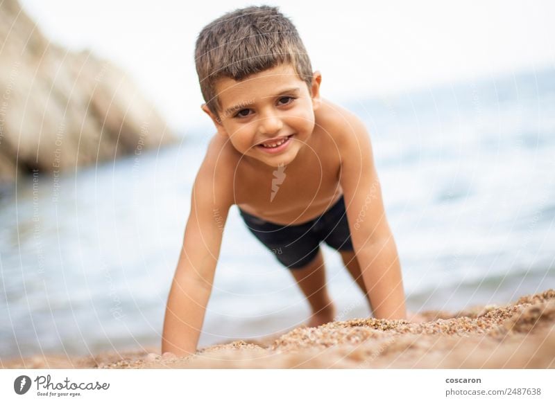 Little boy doing exercise at beach Beautiful Body Leisure and hobbies Playing Children's game Vacation & Travel Tourism Summer Summer vacation Sports