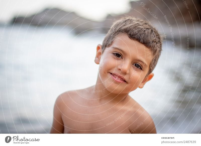 Lovely little boy on the beach smiling looking at camera Lifestyle Face Healthy Vacation & Travel Summer Summer vacation Beach Human being Child Baby Toddler