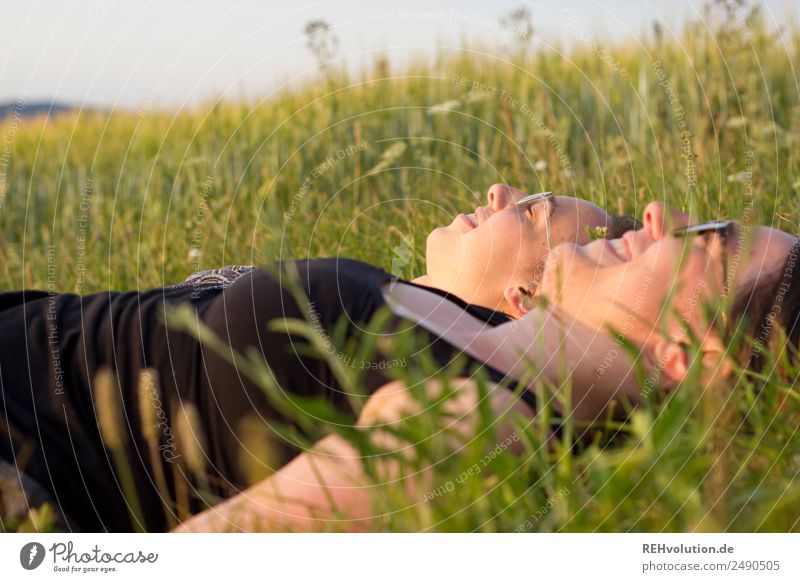 2 women lying on a meadow Happy Free Together Joie de vivre (Vitality) Close-up Smiling To enjoy Meadow Beautiful weather Summer Landscape Sister