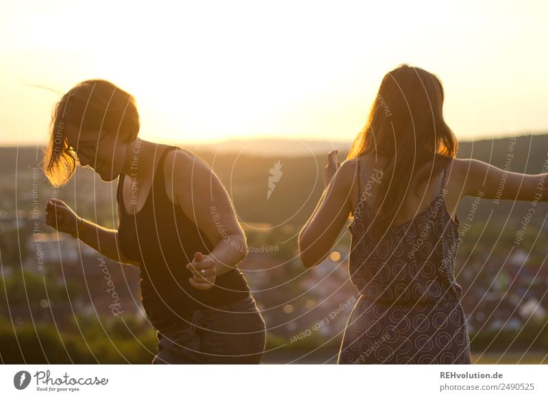 2 young women dancing in the sun Lifestyle Human being Feminine Young woman Youth (Young adults) Brothers and sisters Sister Friendship 18 - 30 years Adults