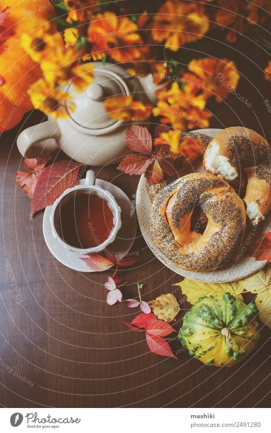 top view of cozy autumn breakfast on table in country house Breakfast Beverage Tea Pot Lifestyle Table Autumn Leaf Wood Brown Safety (feeling of) fall Bagel eat