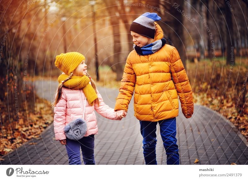 autumn portrait of happy brother and sister walking the road Joy Happy Vacation & Travel Child Sister Family & Relations Friendship Infancy Nature Autumn Leaf