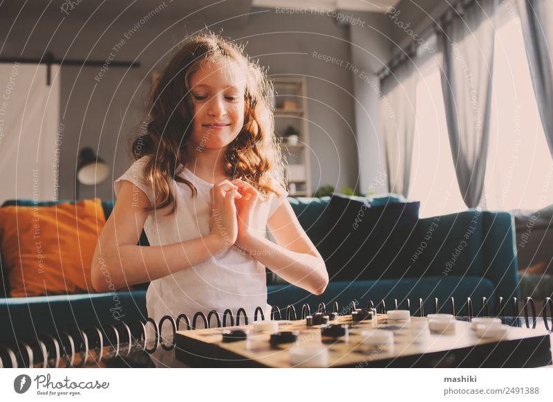 Girl and boy playing chess at home. - a Royalty Free Stock Photo from  Photocase