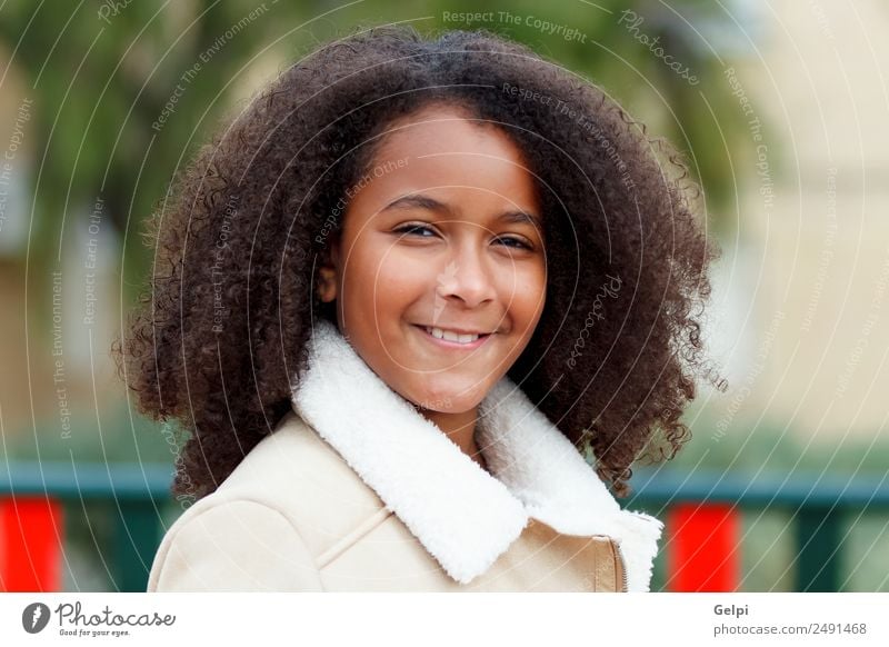 Pretty girl with long afro hair Happy Beautiful Hair and hairstyles Skin Face Child School Woman Adults Sky Warmth Park Coat Afro Cute Colour ten african