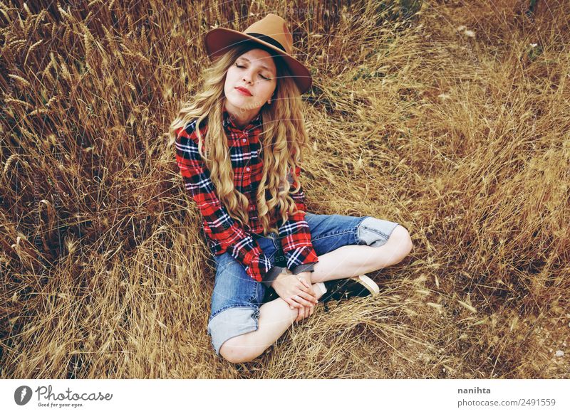 Young woman alone in a wheat field Lifestyle Style Joy Healthy Wellness Harmonious Well-being Relaxation Freedom Human being Feminine Youth (Young adults) 1