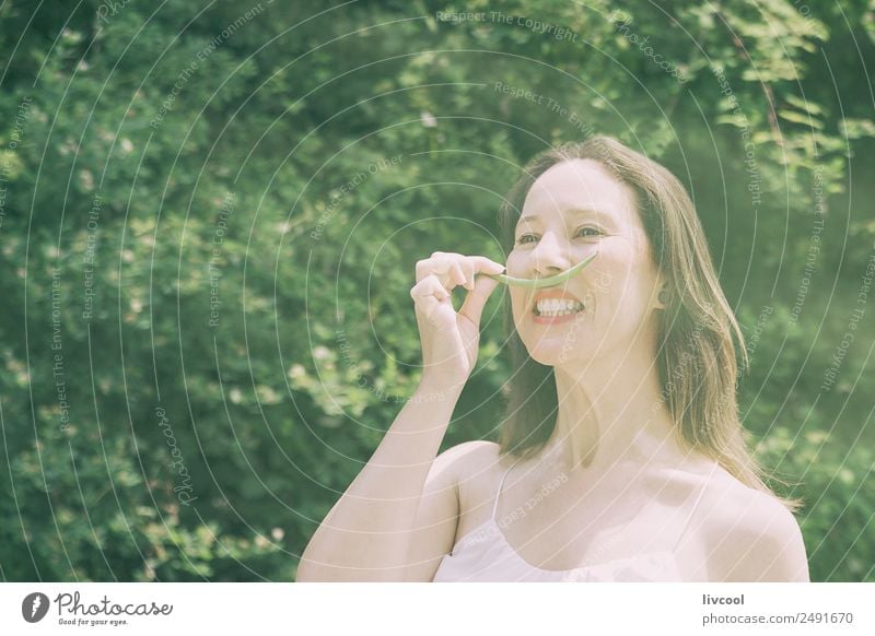 woman joking with green mustaches Lifestyle Elegant Style Happy Beautiful Face Summer Garden Human being Feminine Woman Adults Female senior Hair and hairstyles