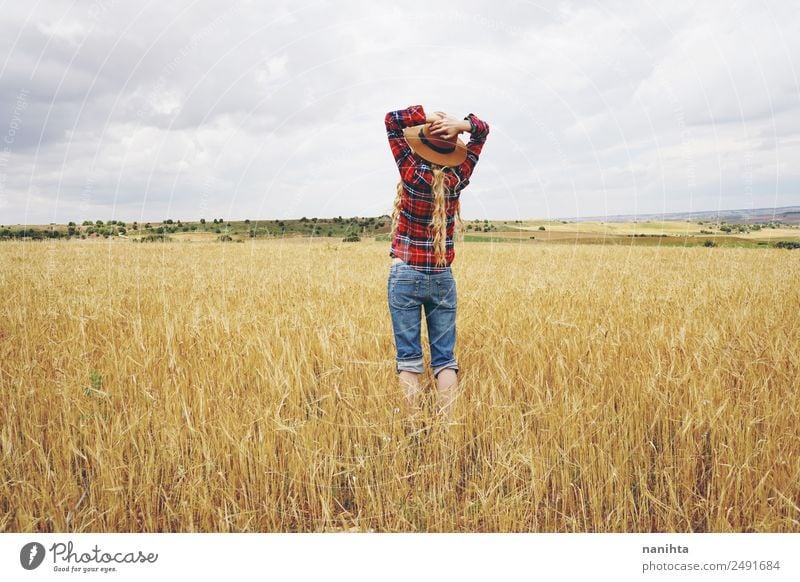 Young woman in a field of wheat Lifestyle Healthy Wellness Well-being Relaxation Summer Farmer Agriculture Forestry Industry Human being Feminine