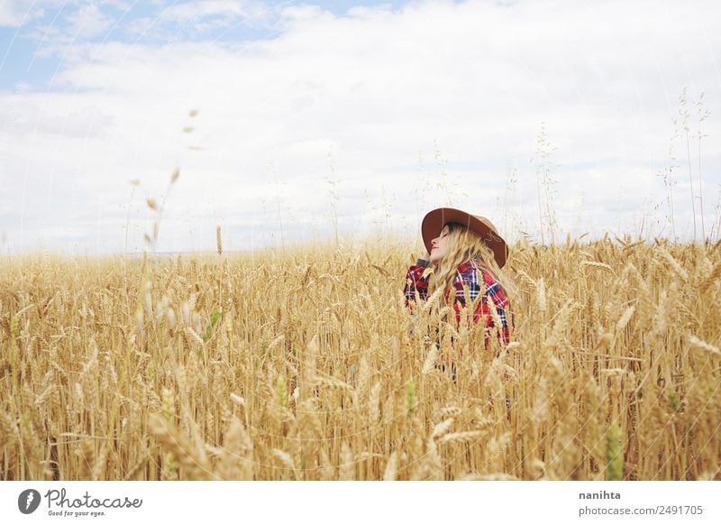 Young woman sitting in a wheat field Food Grain Agriculture Forestry Human being Feminine Youth (Young adults) Woman Adults 1 18 - 30 years 30 - 45 years