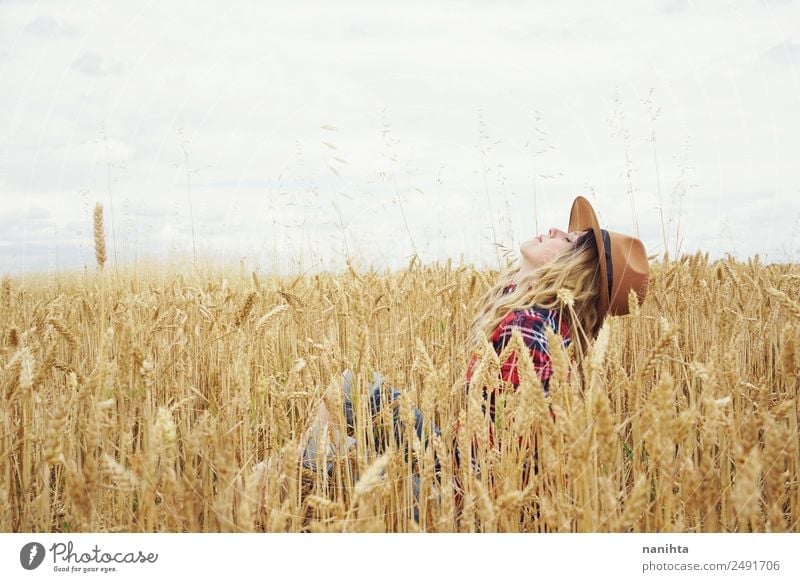 Young woman surrounded by wheat crops Grain Wheat Wheatfield Organic produce Lifestyle Style Joy Wellness Harmonious Well-being Adventure Freedom Summer