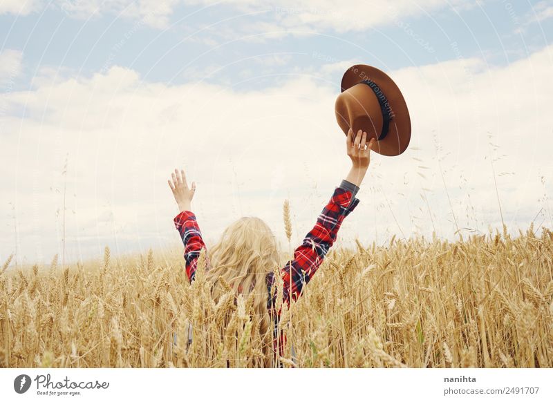 Back view of a young woman in a wheat field Grain Wheat Lifestyle Style Joy Healthy Wellness Harmonious Well-being Vacation & Travel Adventure Freedom Summer