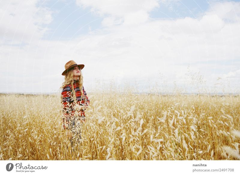 Young woman alone in a field of wheat Grain Lifestyle Healthy Wellness Senses Relaxation Calm Agriculture Forestry Human being Feminine Youth (Young adults)