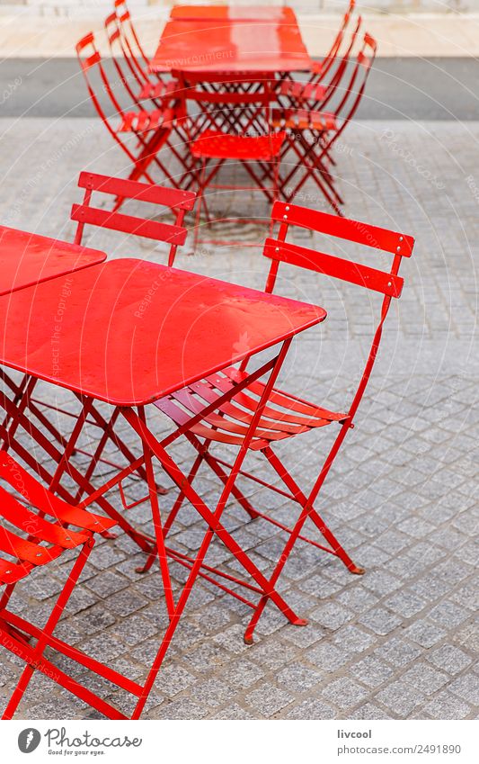 Red chairs and tables from a terrace in a bar Lifestyle Style Design Happy Relaxation Winter Furniture Chair Table Restaurant Gastronomy Village Facade Terrace